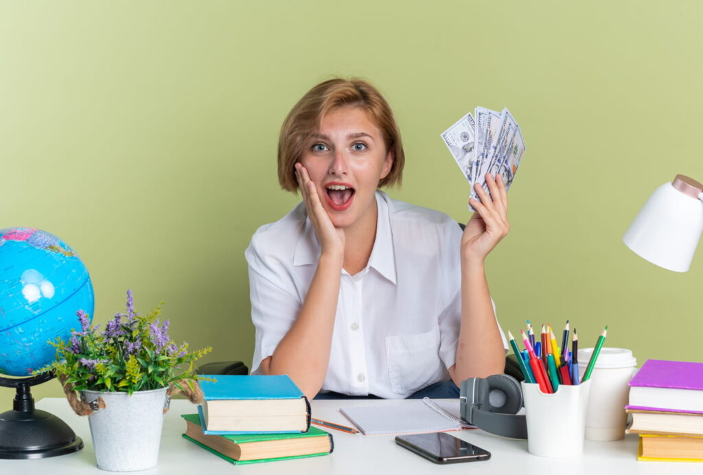 american women holding money and giving surprise reaction