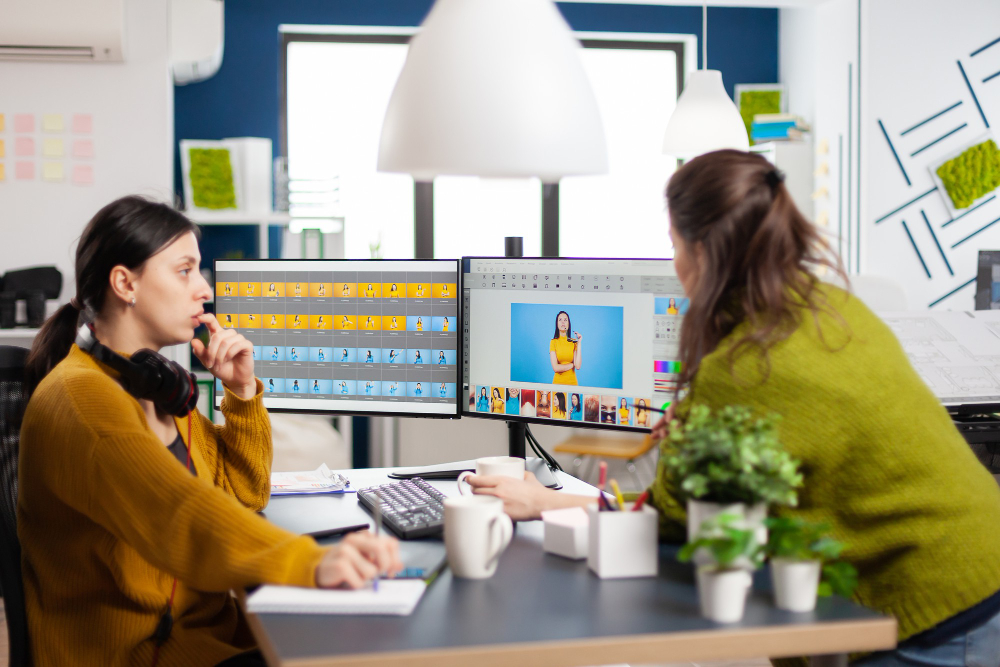 two lady office worker discuss about image graphic
