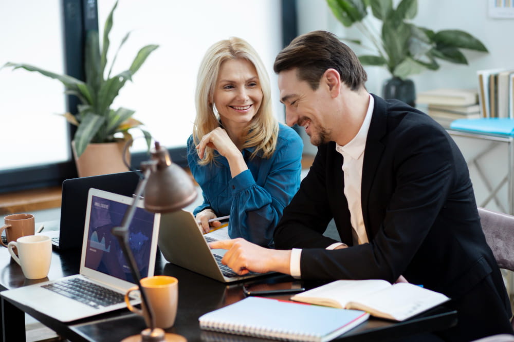 two cowerkers work toghther in office