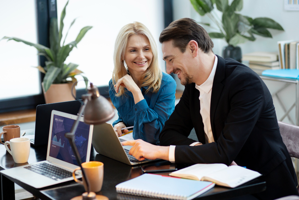 two cowerkrs work together in office