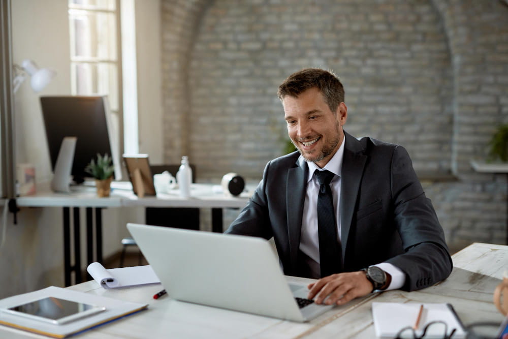 man working on laptop in office