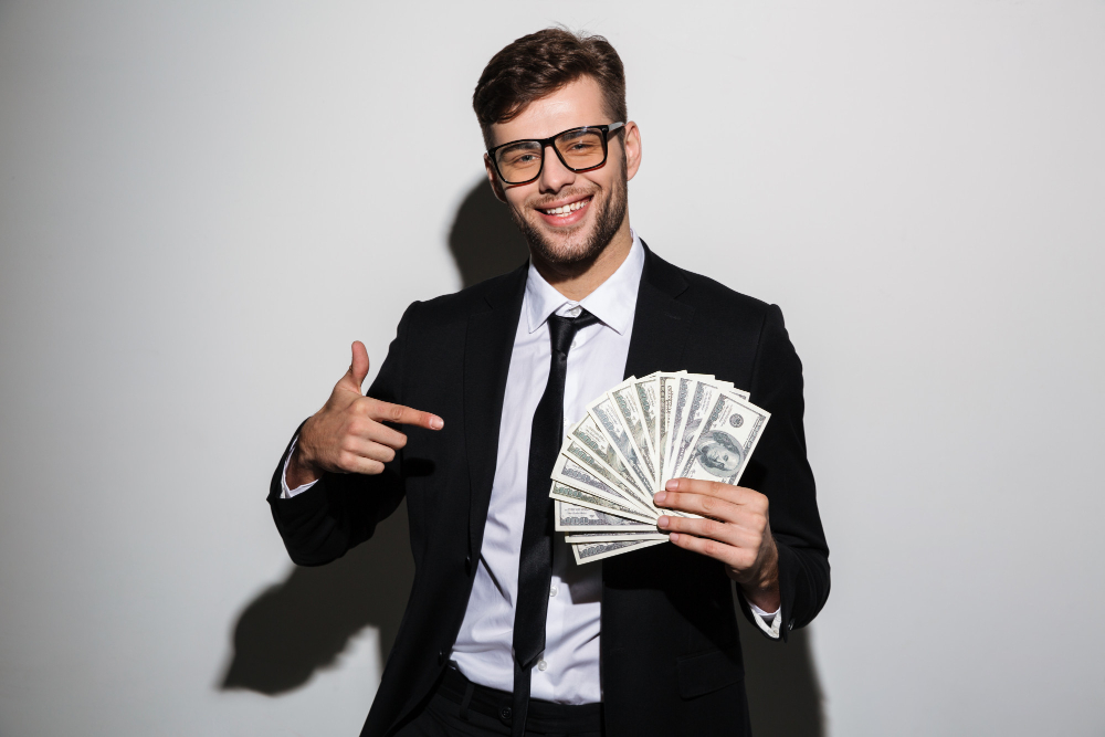 a man holding money he earn by freelancing